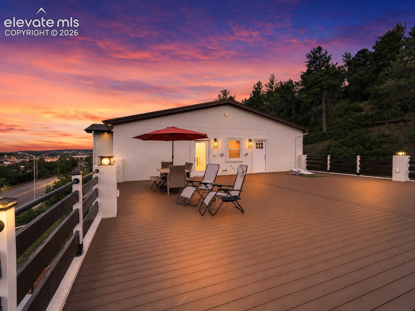 A massive 40x40 composite deck extends the home's entertaining potential with panoramic views toward Blodgett Peak & beyond.