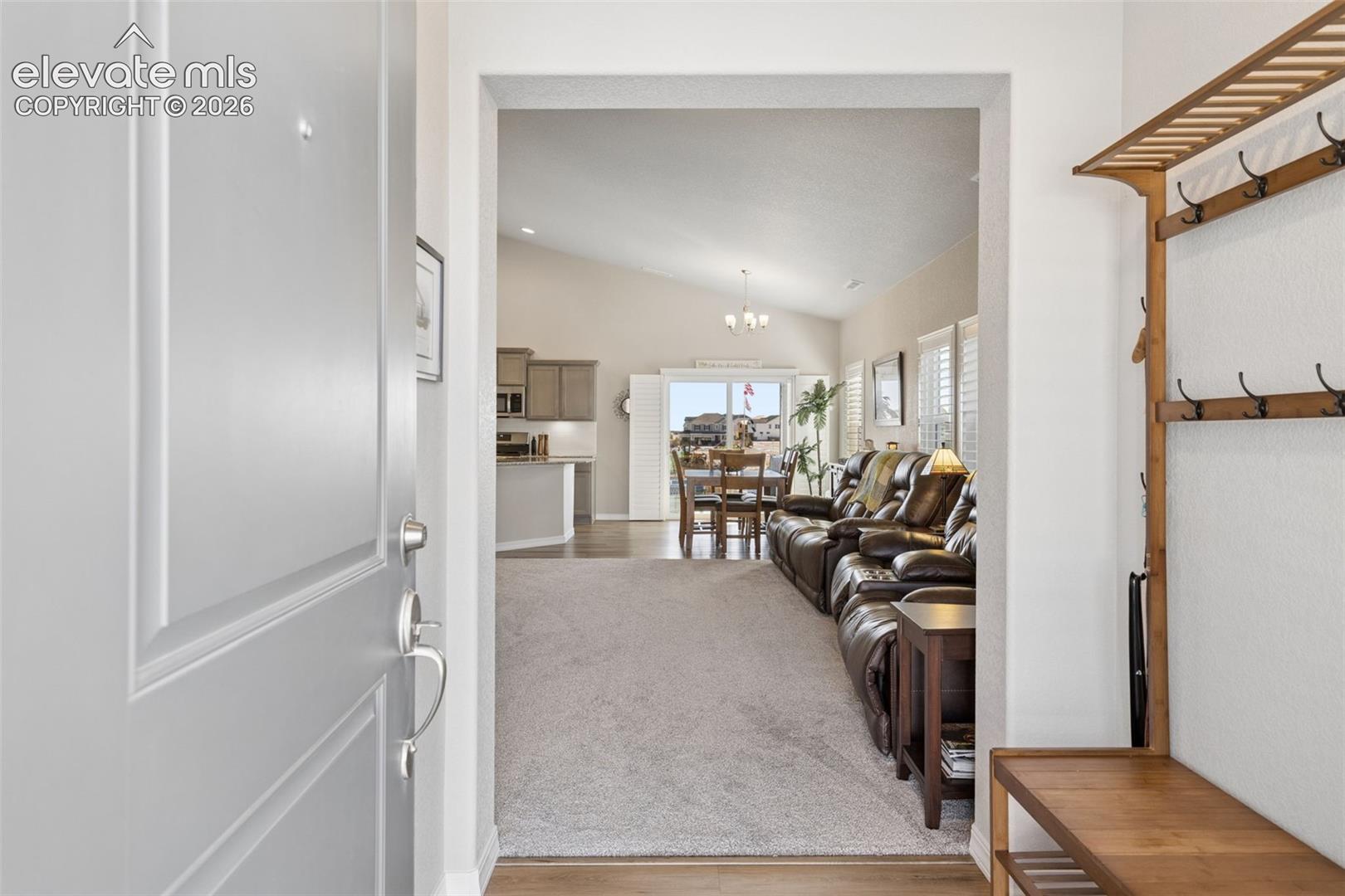 Covered entry has space for coats and shoes.
