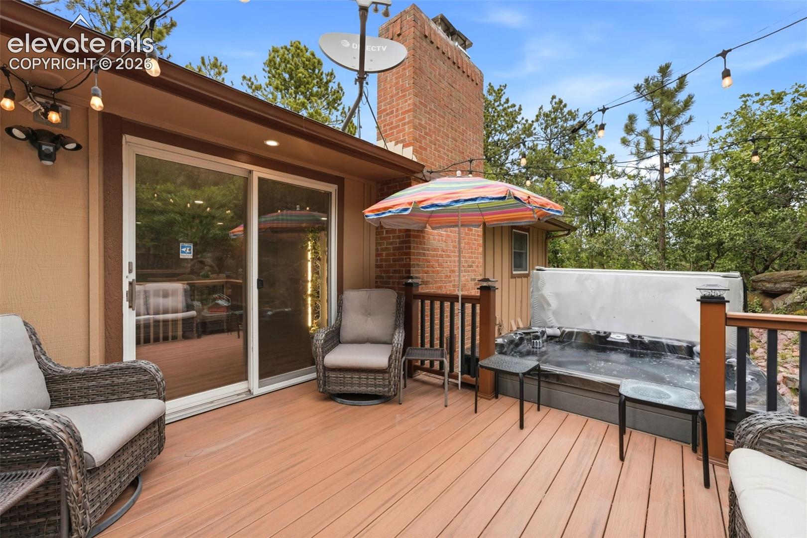 deck features plenty of room for outdoor furniture, making it the perfect setting for summer barbecues, morning coffee, or relaxing while enjoying the panoramic views of the backyard and surrounding landscape.