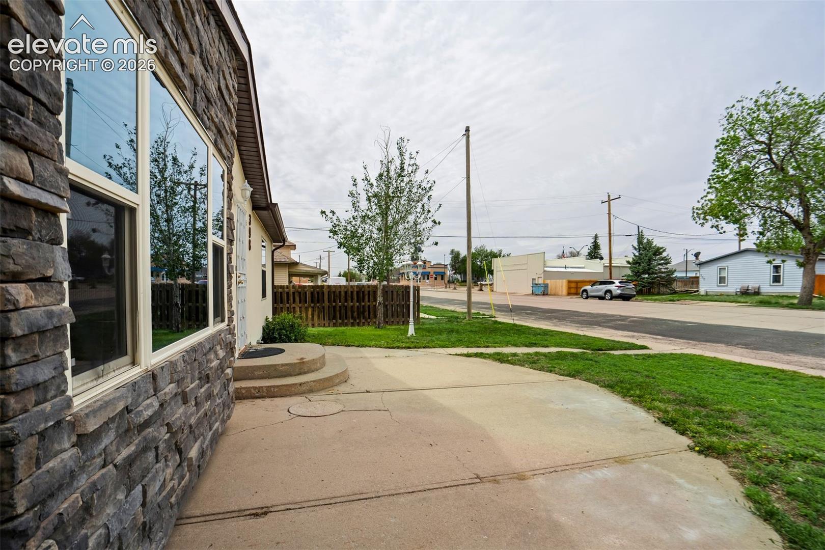 Stone veneer detail adds dimension and architectural interest to the exterior.