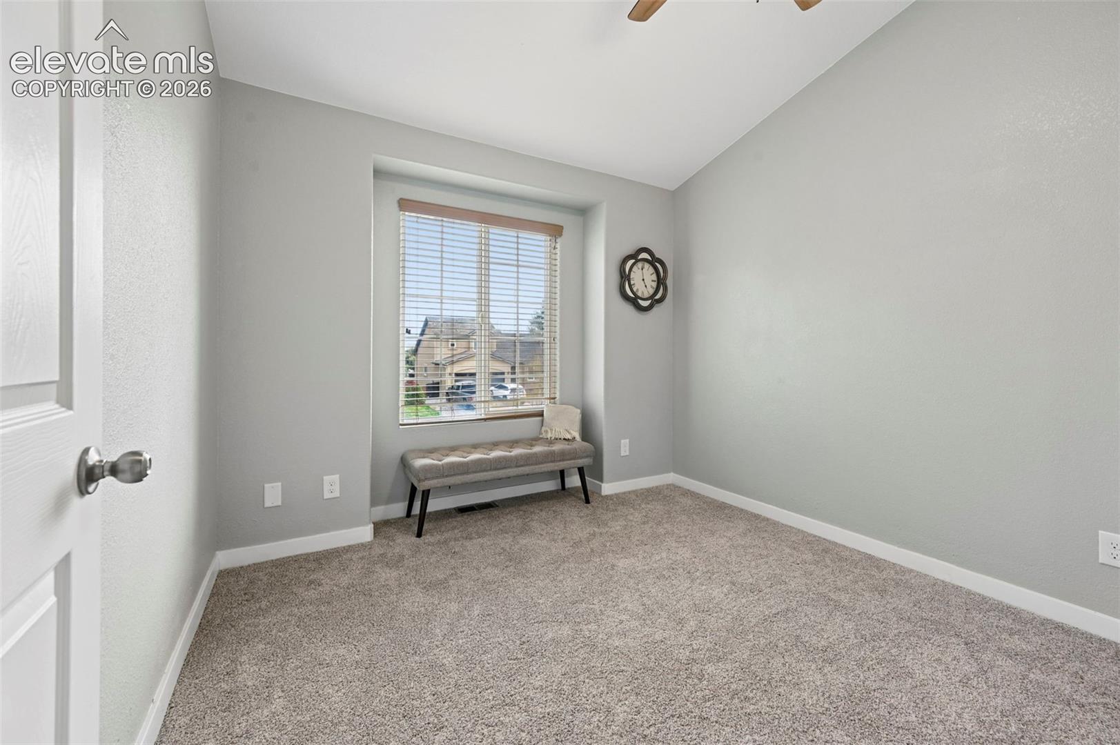 Vaulted ceilings, carpeted flooring, ceiling fan and Closet