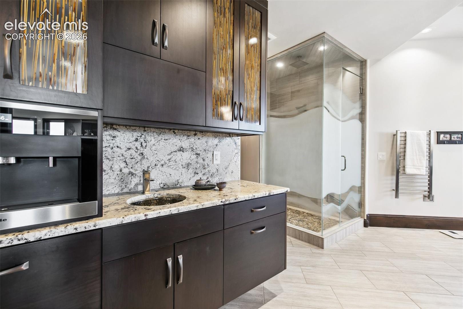 Morning kitchen with refrigerator, microwave and sink.