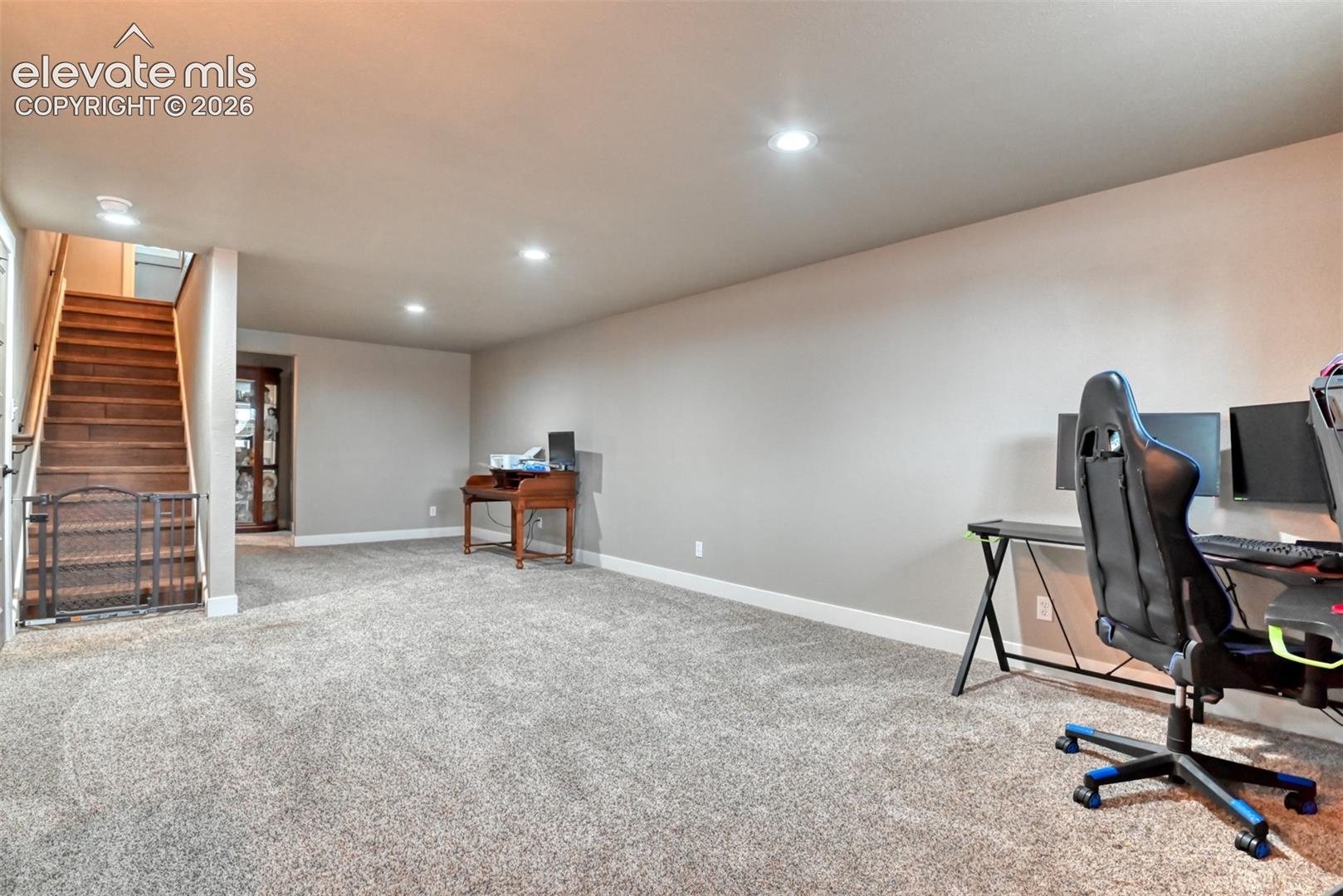 Home office featuring light carpet and recessed lighting