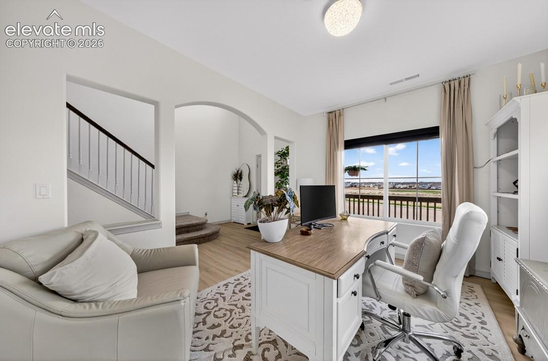 Luxury vinyl, large windows, view of front, main level