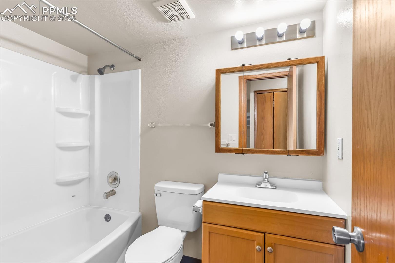 Full bath with tub / shower combination and vanity