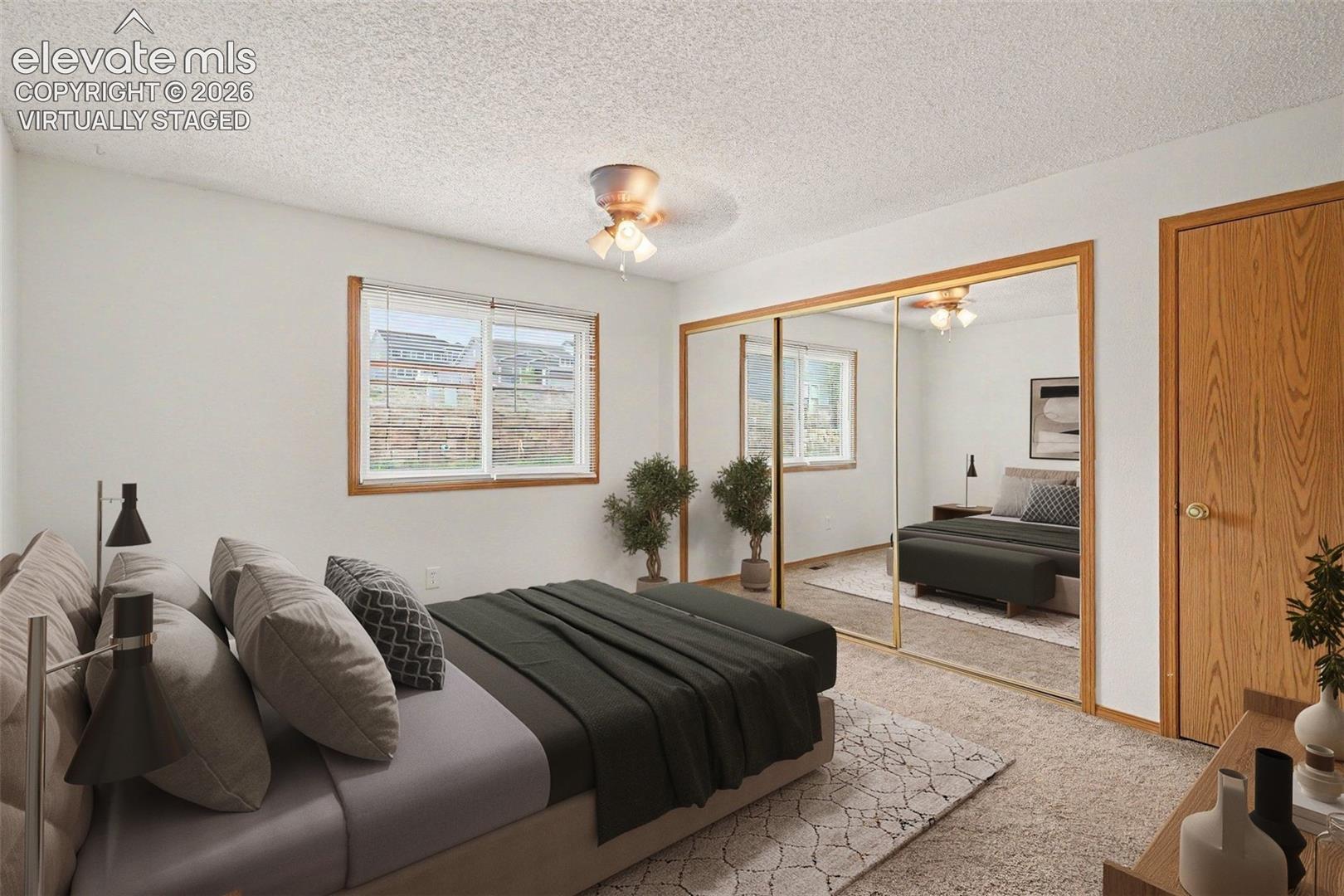 Virtually staged bedroom with adjoining bathroom