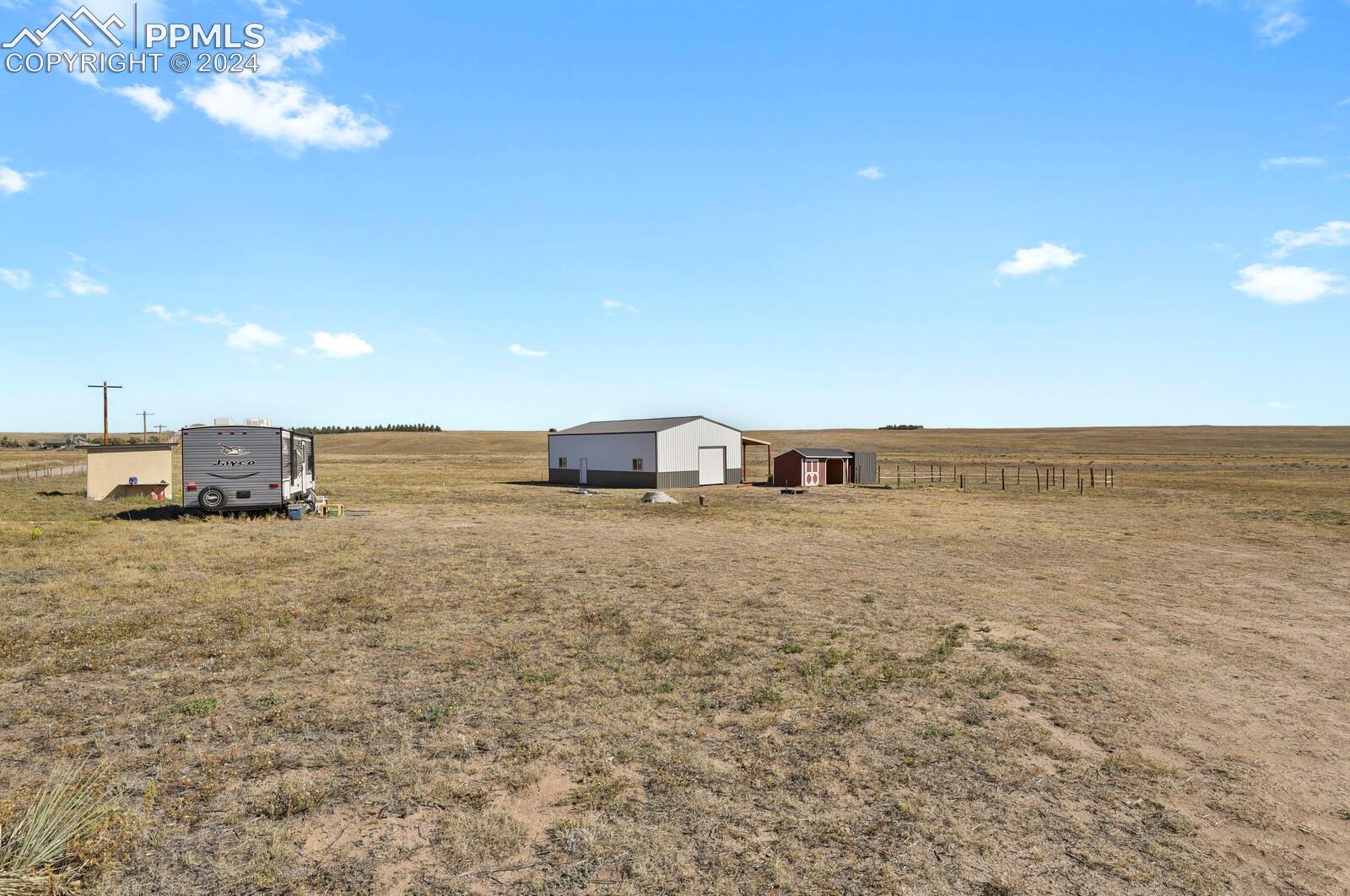 Multiple outbuildings provide additional storage and flexibility