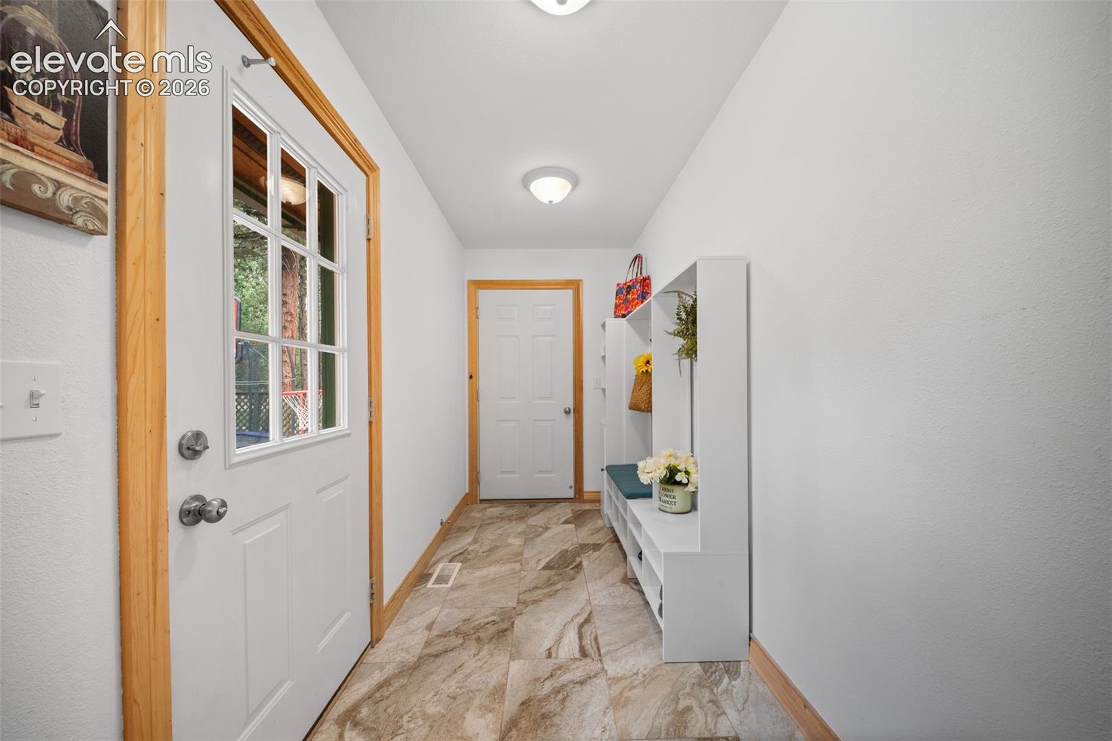 Main level entry from garage and access to the backyard