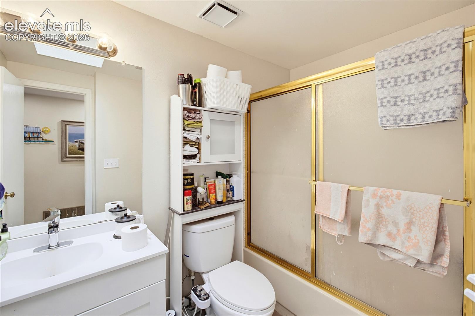 White vanity with an integrated sink and chrome faucet