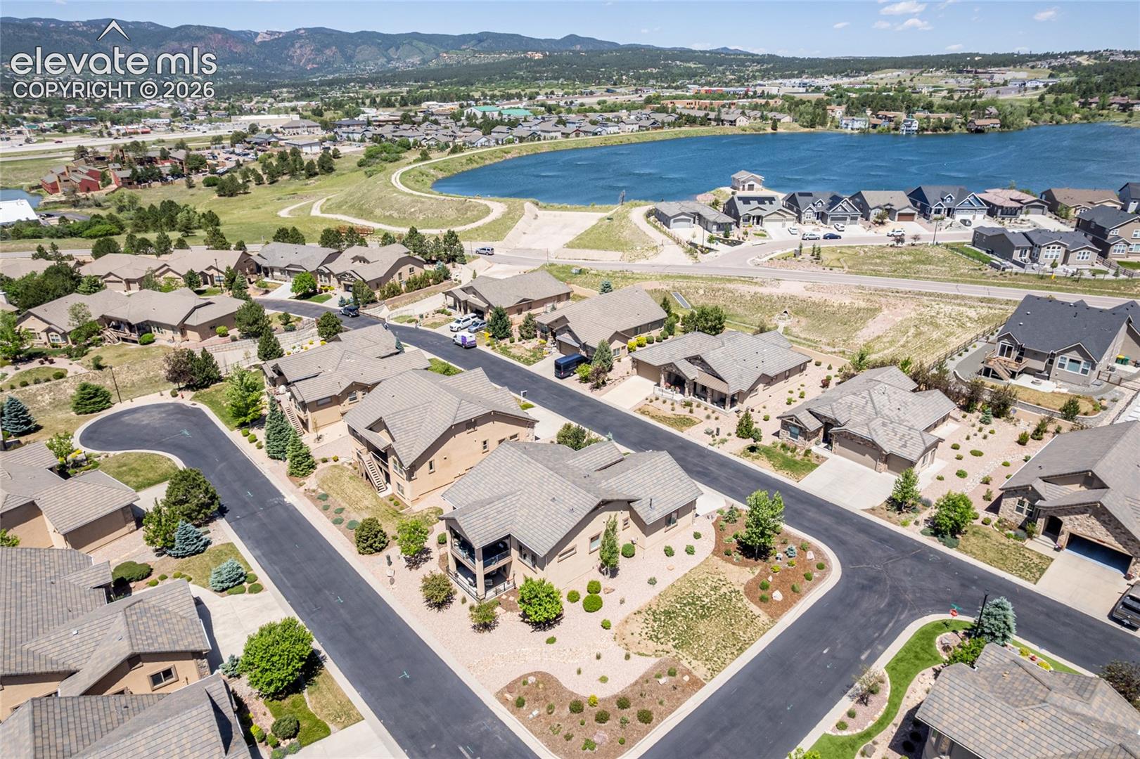 Enjoy Lake Woodmoor and mountain views on your walk morning, noon, or night!