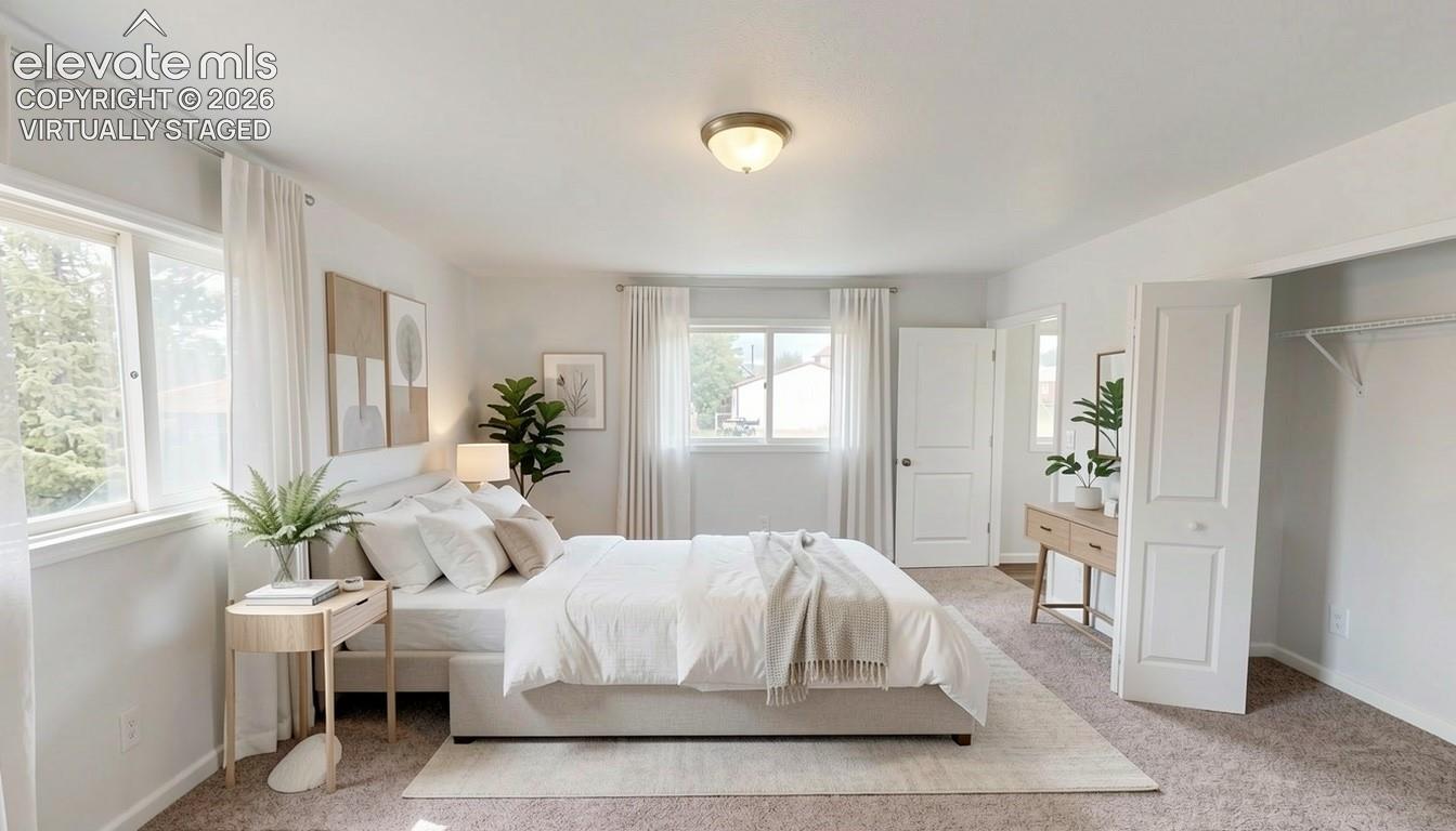virtually staged.Wall-to-wall carpeting, dual windows with curtains, and a ceiling-mounted light fixture