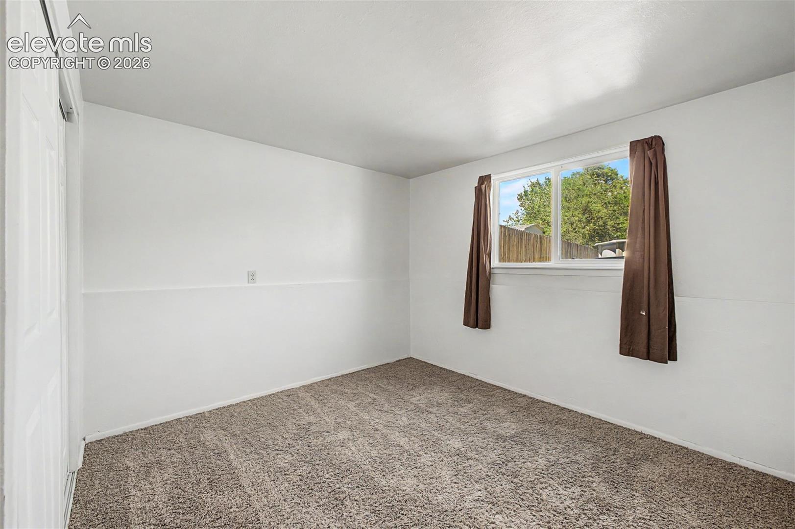 Lower level bedroom makes for a perfect office or guest room. 