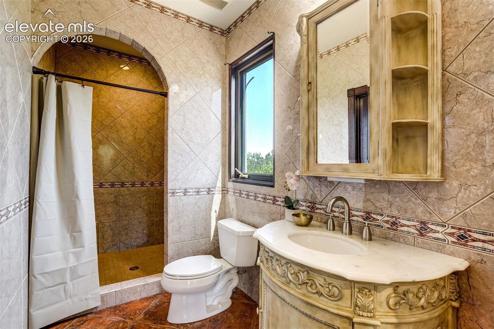 Walk-in shower & custom finishes. 