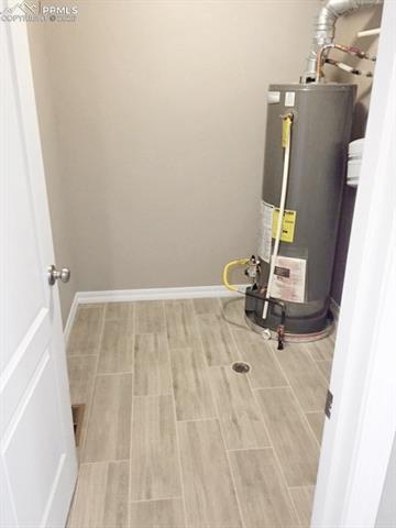 Laundry room with gas water heater