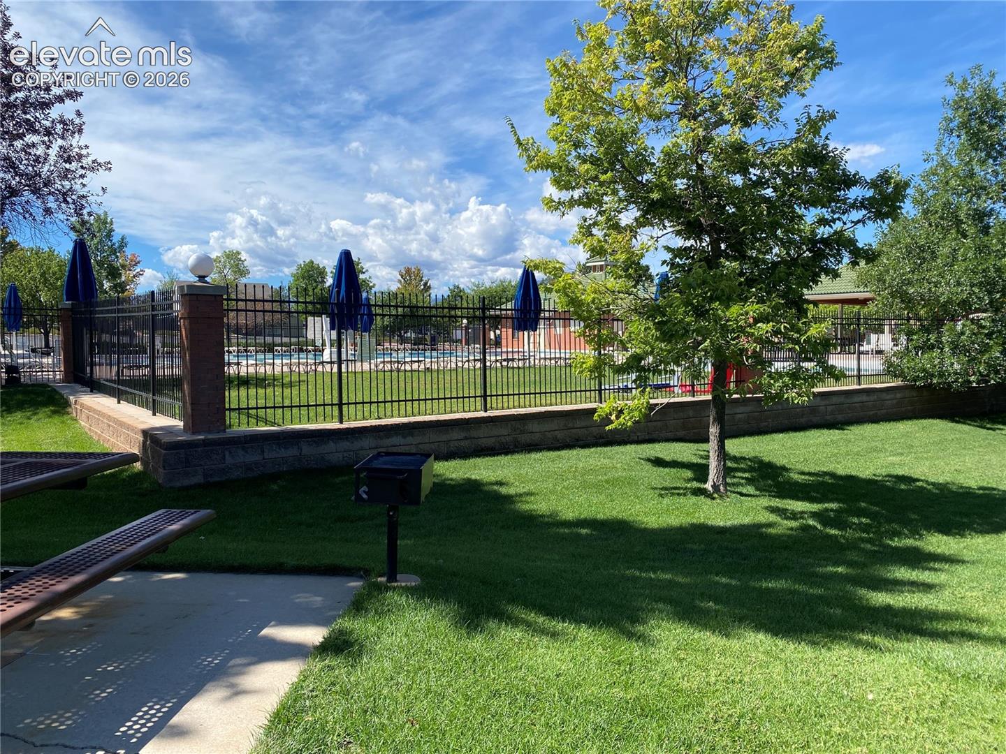 Looking towards the fenced in pool from one of the picnic areas.