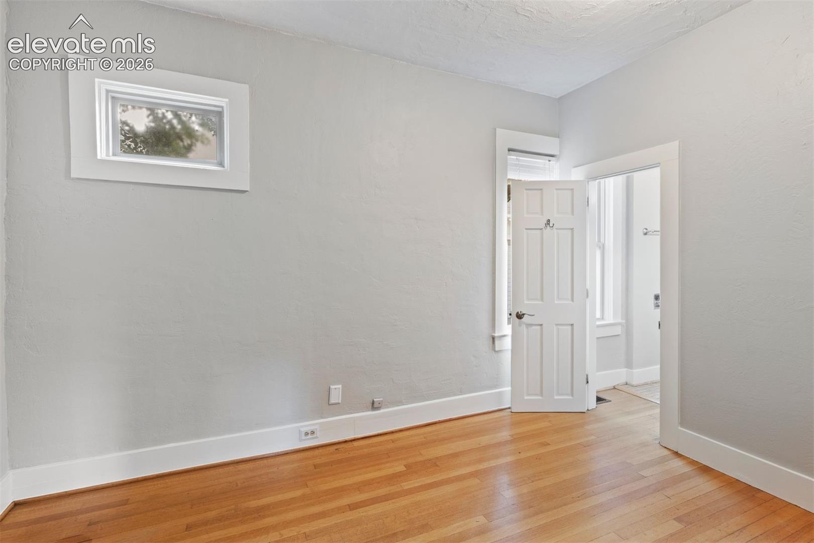 Main level bedroom with ensuite bathroom and walk in closet
