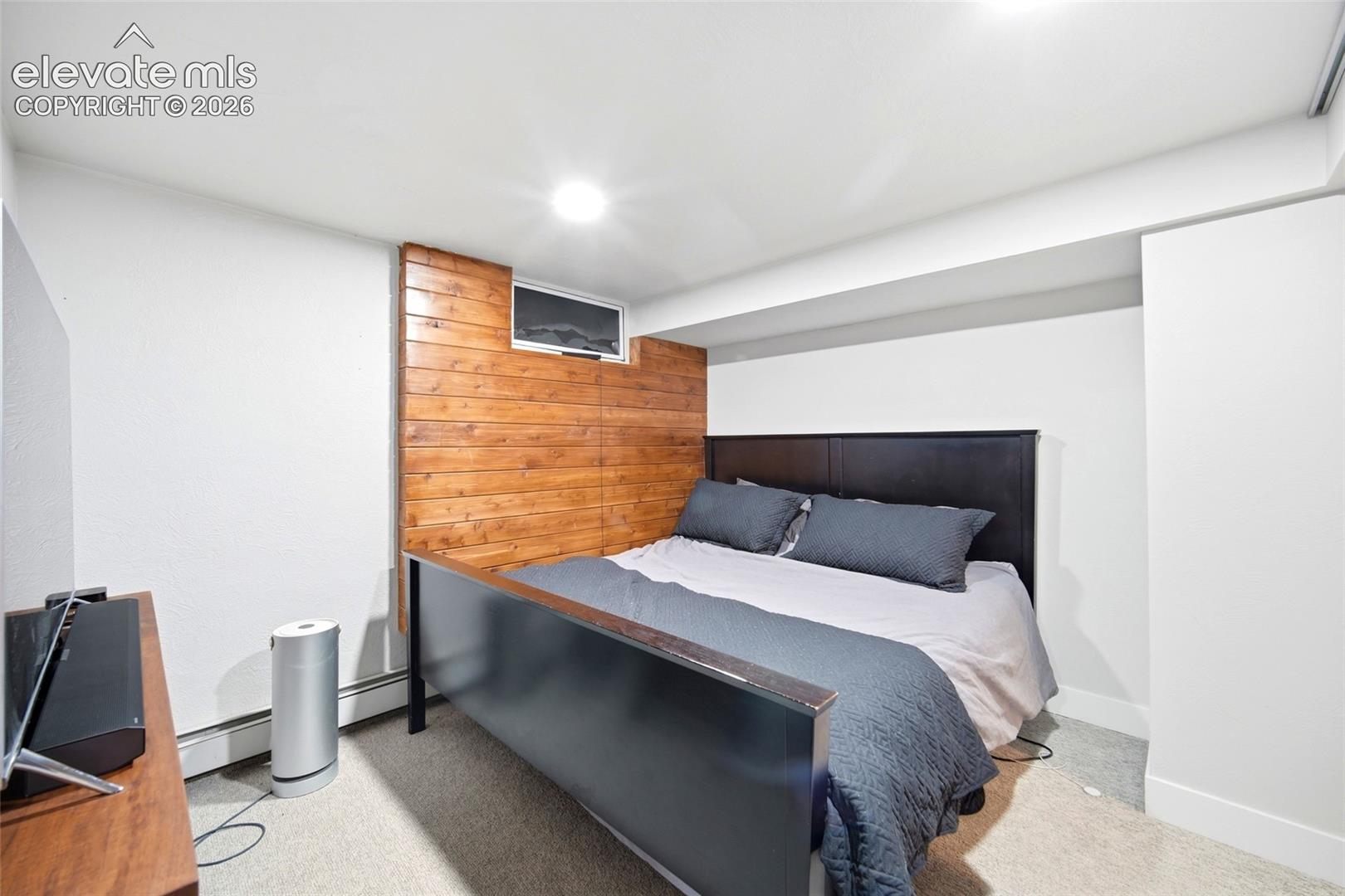 This bedroom has room for a king-sized bed and your furnishings. 