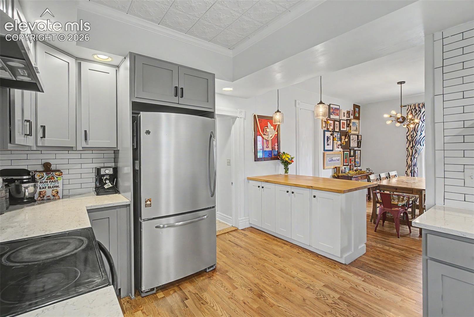 Kitchen to dining room open floor concept emphasizing an open and inviting space.