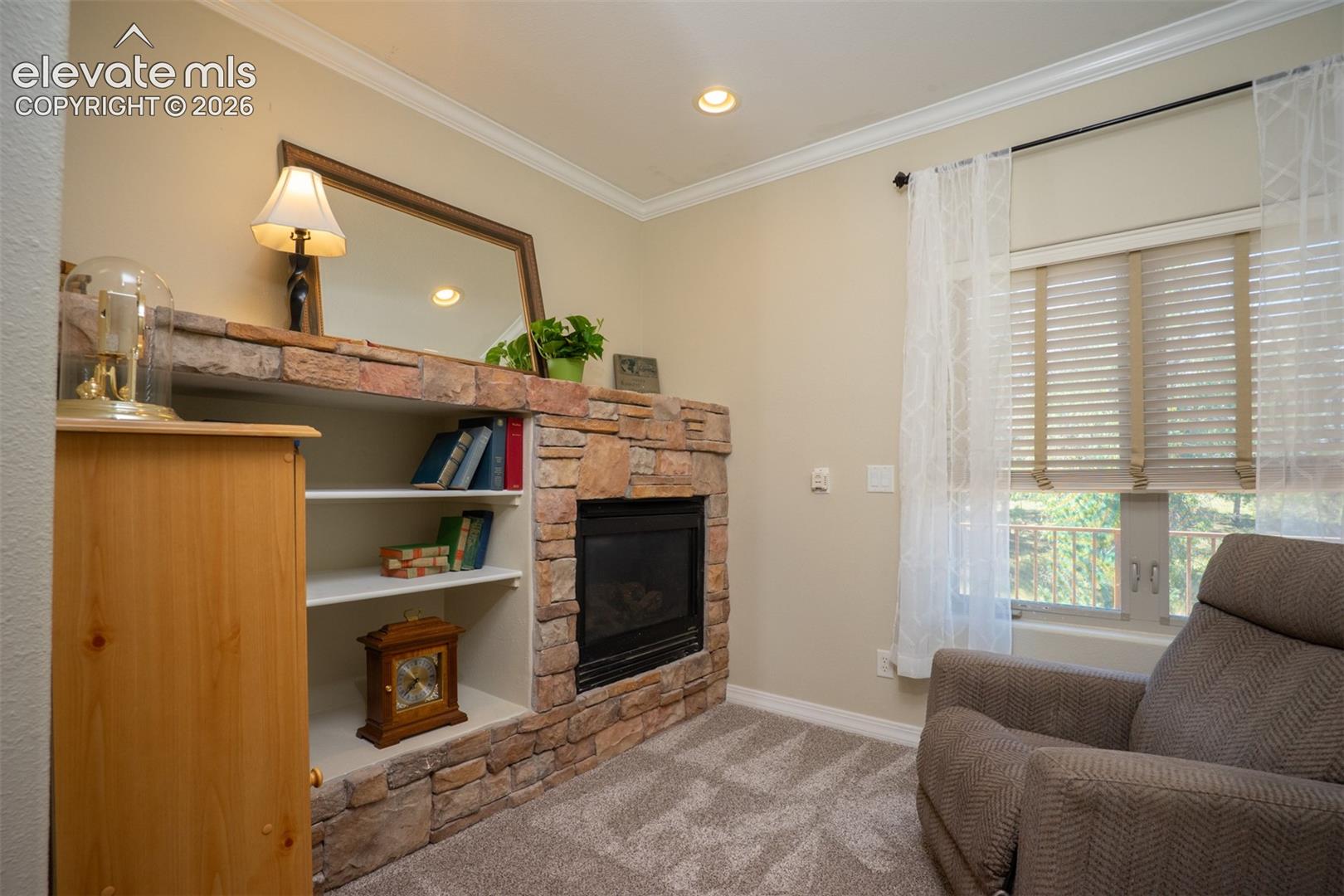 This sitting room is right off the master bdrm and hallway. Great for reading and relaxing in front of a nice fire.