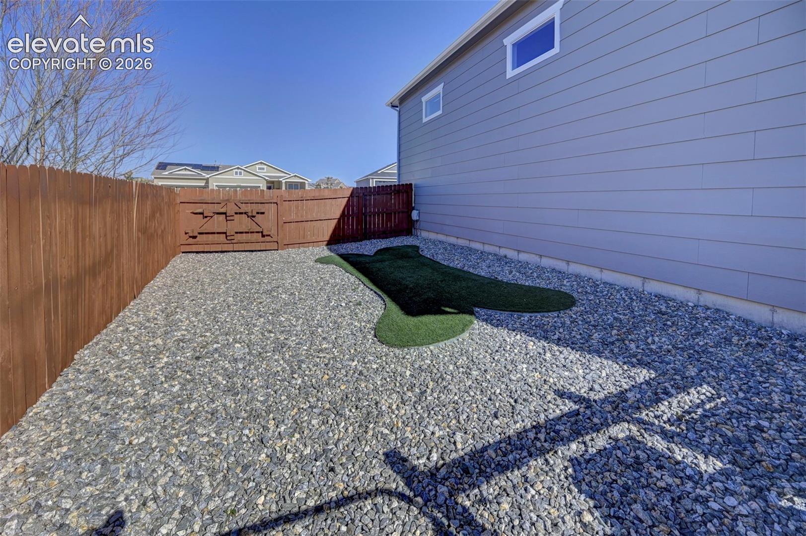 Gravel ground cover with an artificial turf accent