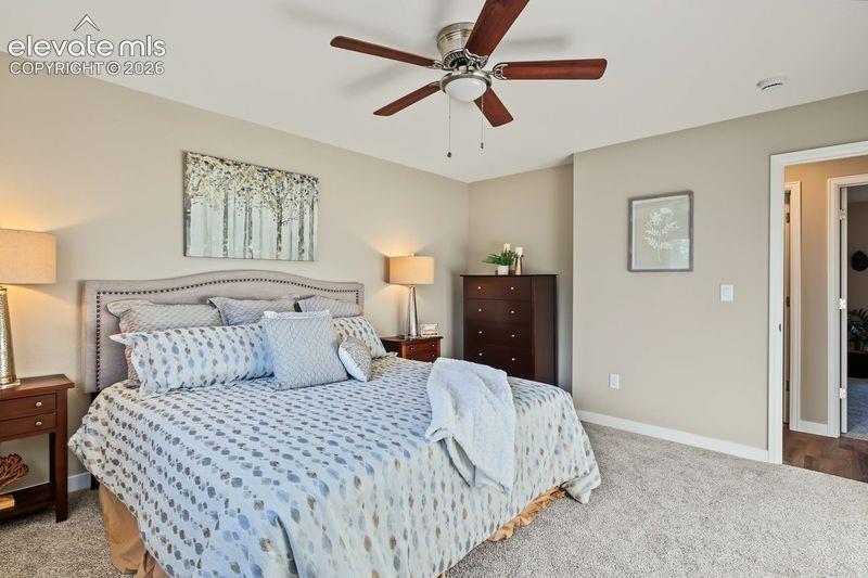 Primary bedroom with ceiling fan