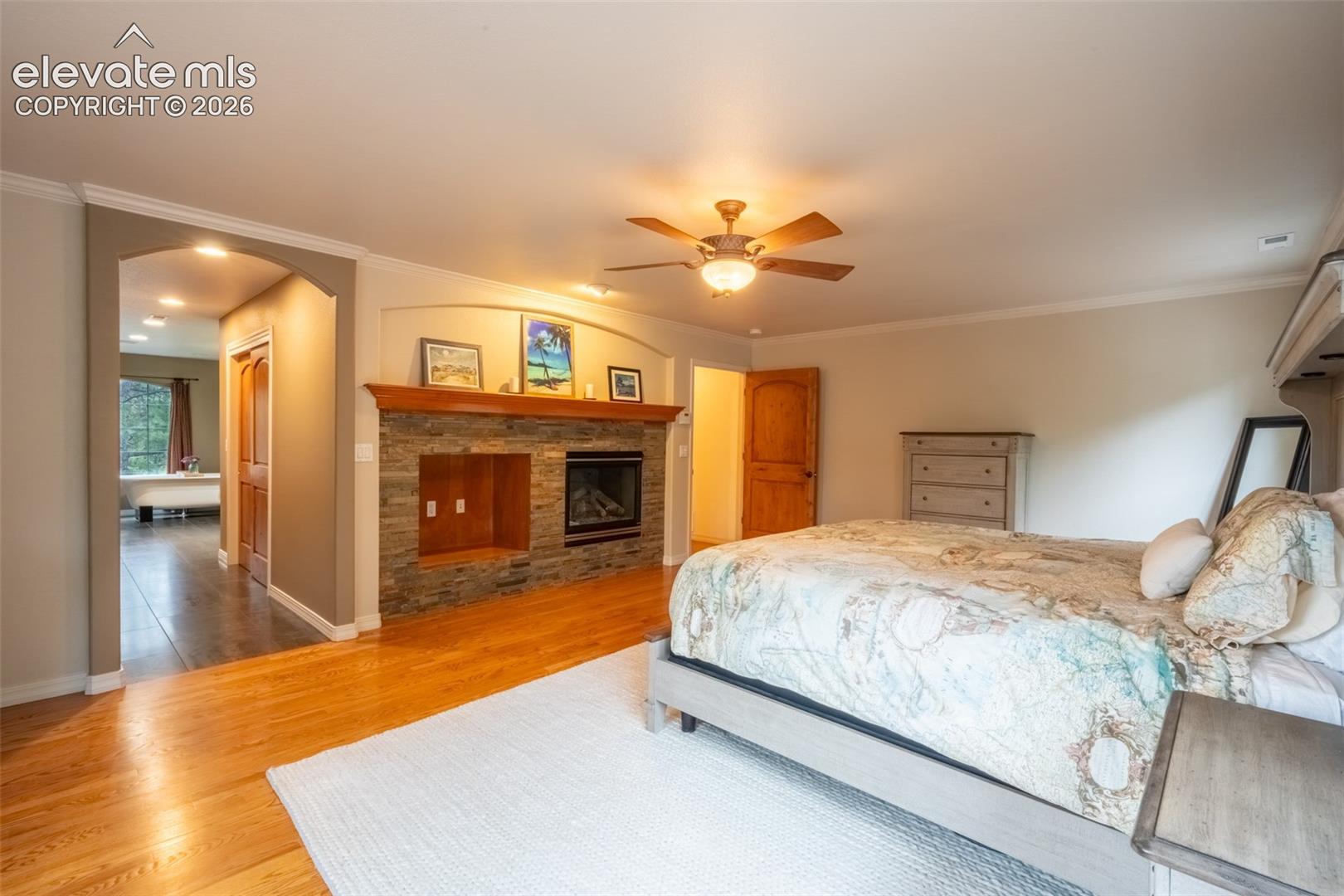 Primary bedroom (1) with fireplace, double walk in closet, and ensuite 5 piece bath - upper level