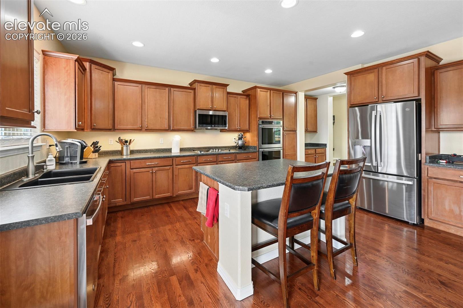 Stanless steel appliances and wood floors