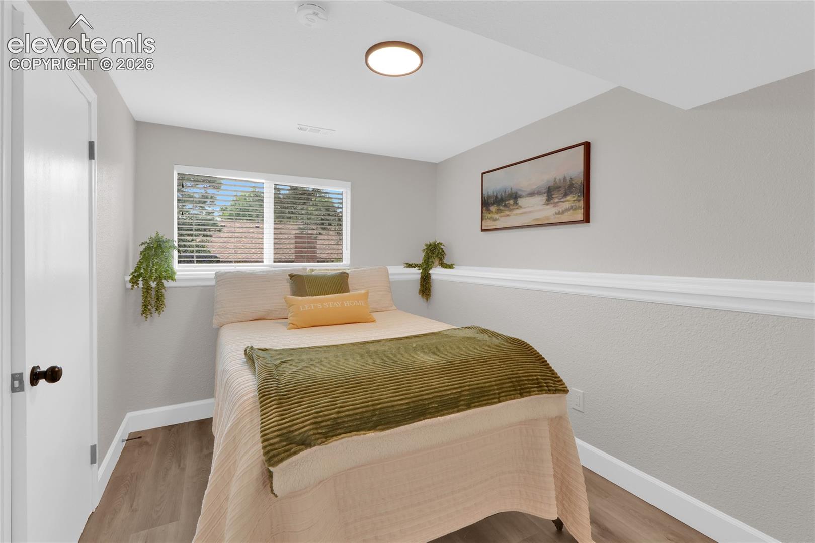 Fourth bedroom or office on lower level with walk-in closet.