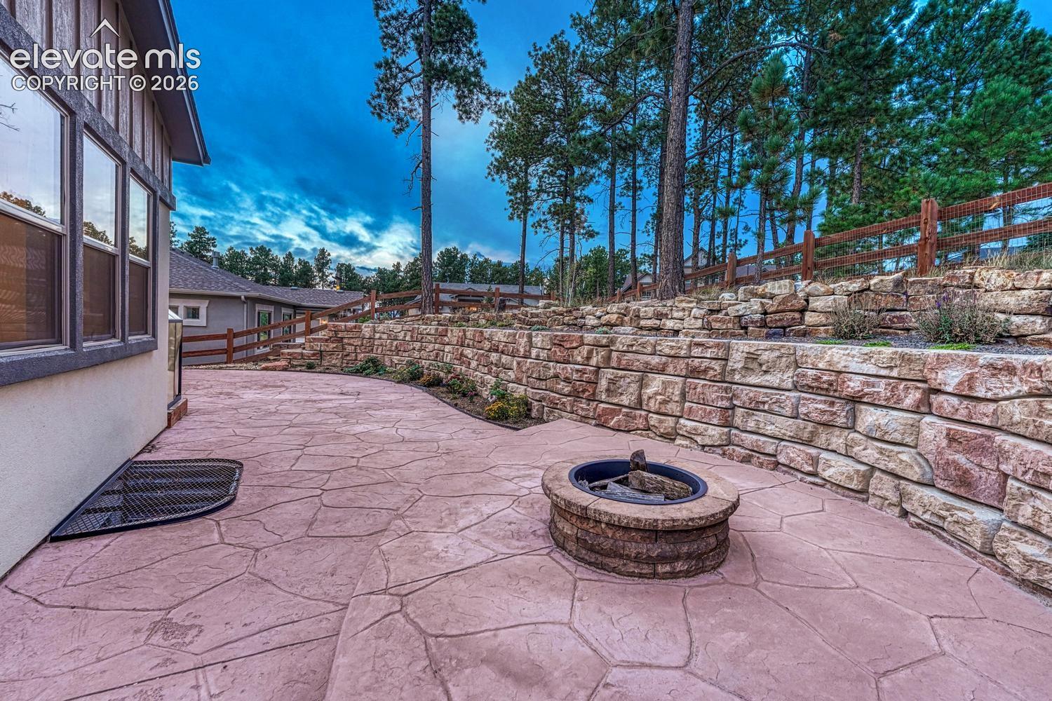 custom firepit offering privacy and plenty of room to entertain