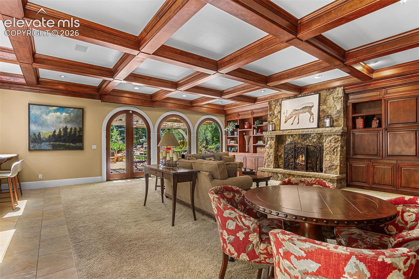 Gorgeous woodwork in living area off of kitchen with 10 ft ceilings.