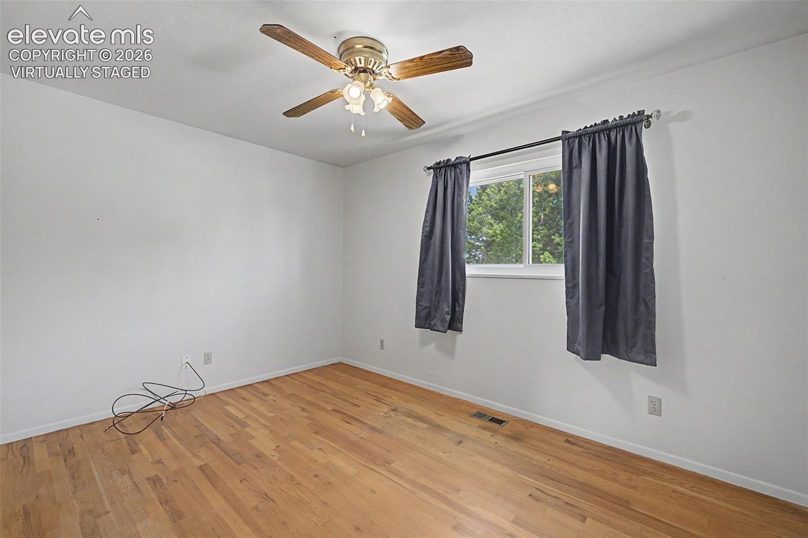 Virtually Staged with flooring - wood flooring under carpet