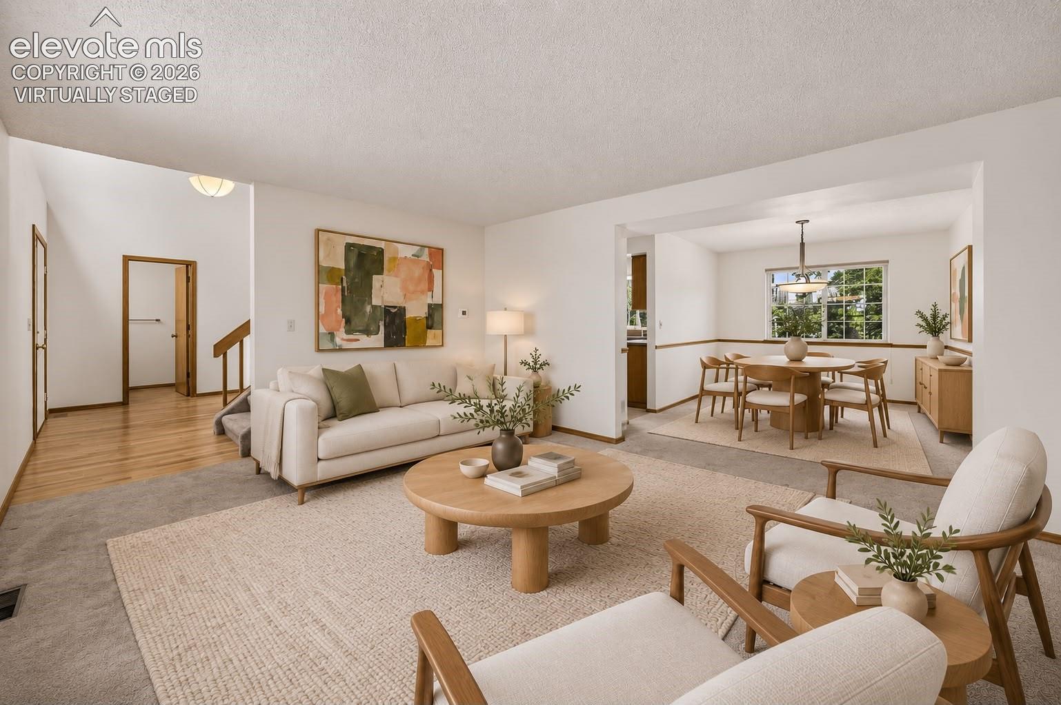 Virtually staged living & Dining area off entryway