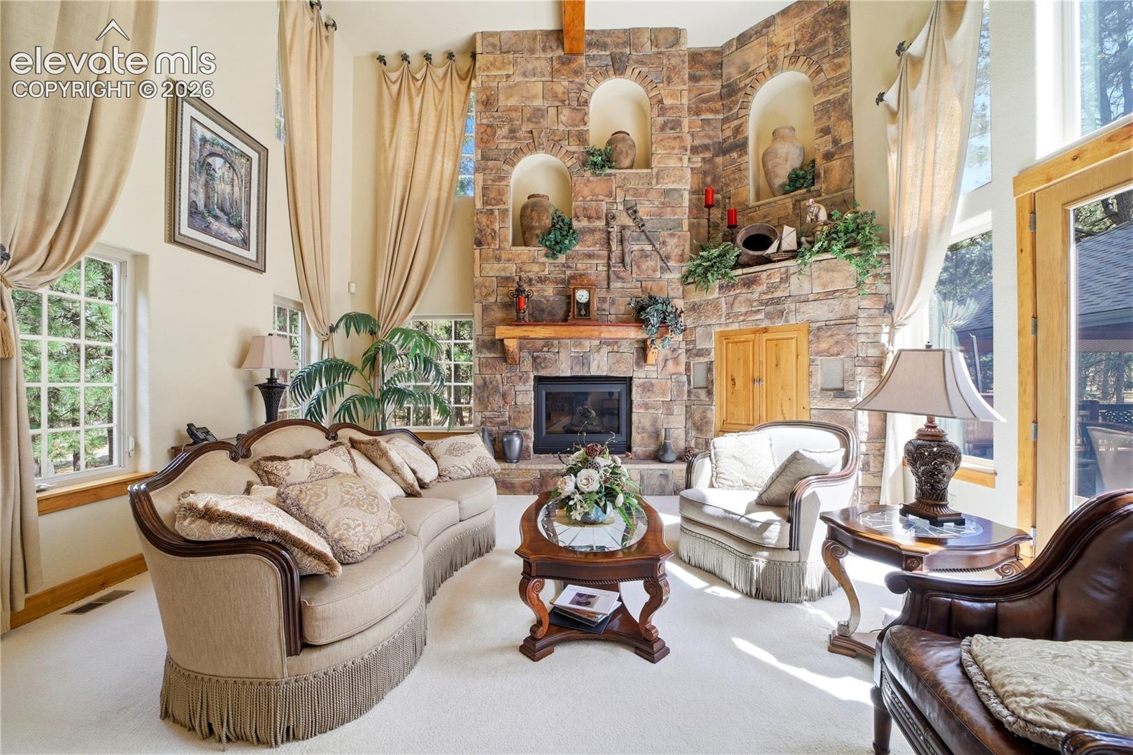 great room sone fireplace 2 story high.