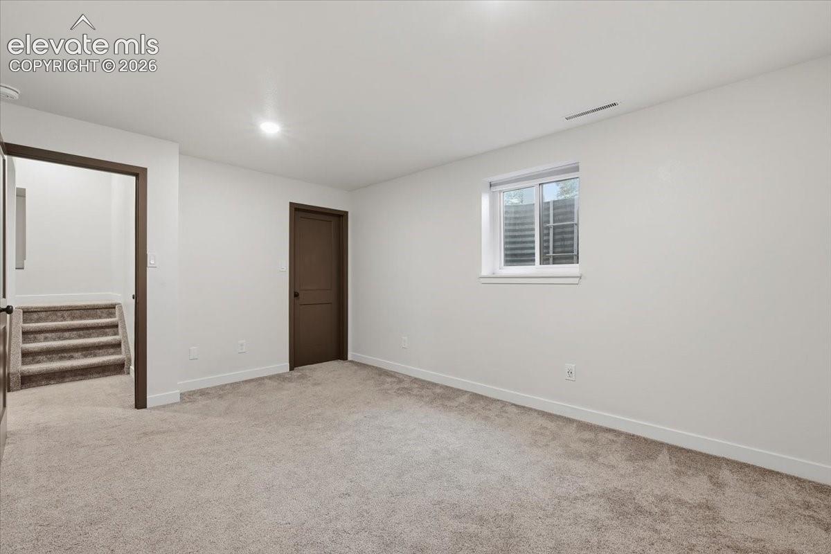 Bedroom 5 - Basement Recessed lighting, walk in closet and crawlspace access