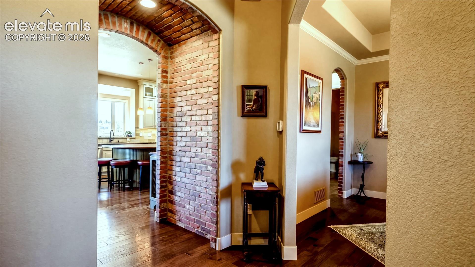 Distinctive brick archways, knotty alder accents + wide-plank engineered wood floors introduce the home's layered palette of natural materials + thoughtful craftsmanship.