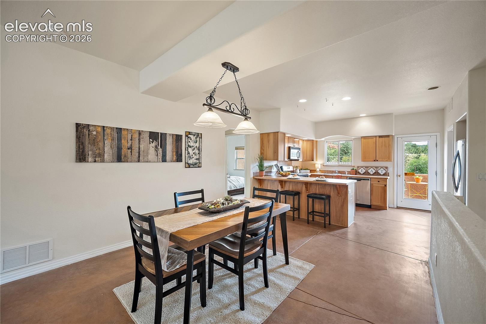 Dining room open to the kitchen and perfect for entertaining. 