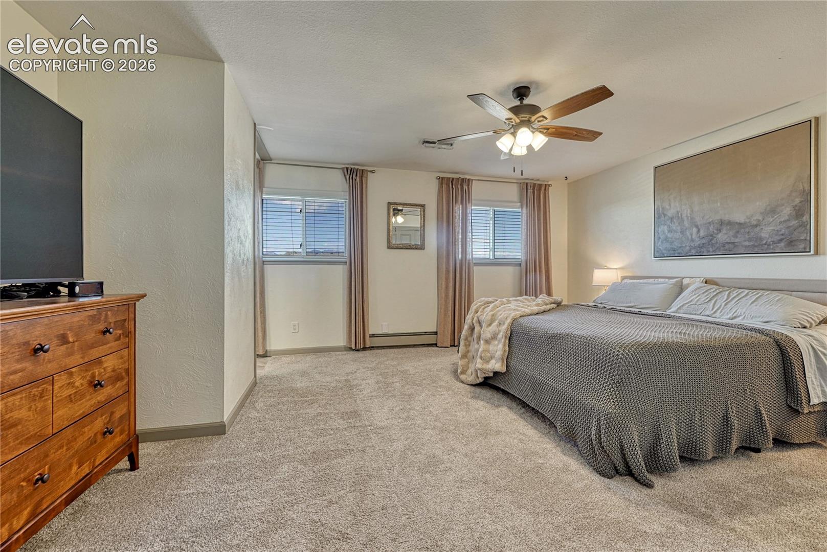 Primary bedroom with room for a dresser
