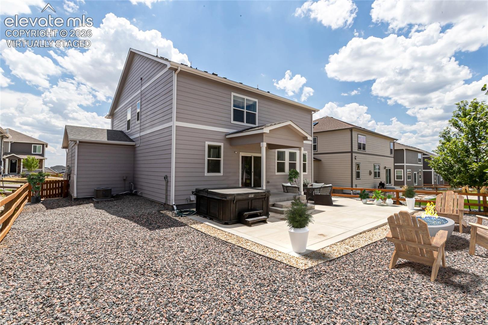 Virtually staged backyard and patio.