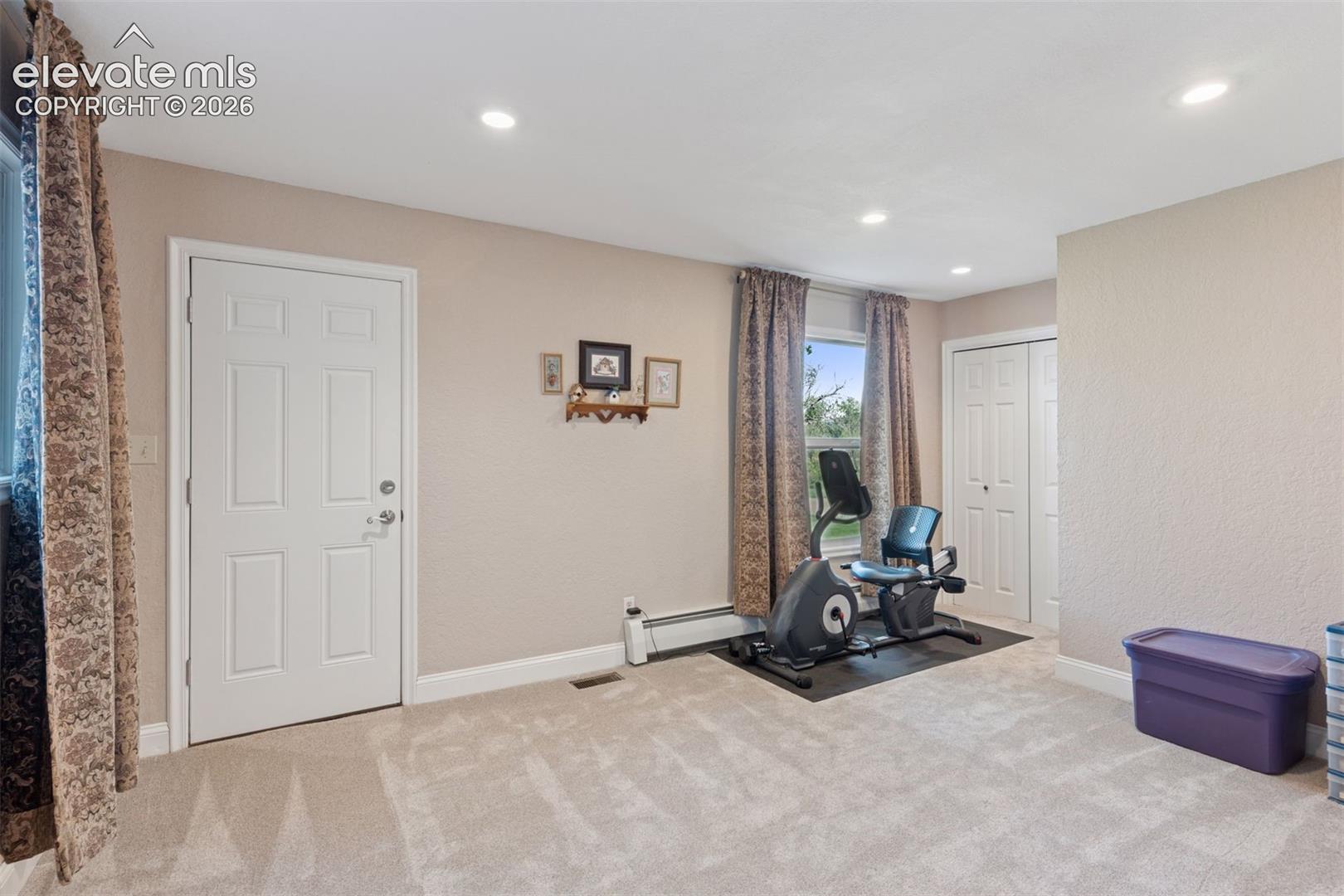 Flexible Bedroom/Bonus Room with Full Bath & Exterior Patio Access