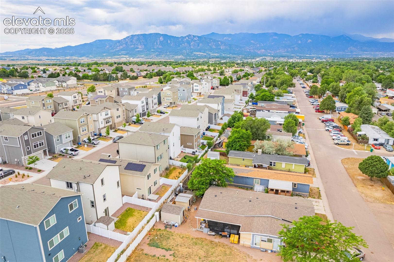 Aerial perspective showcasing a residential neighborhood with varied housing styles