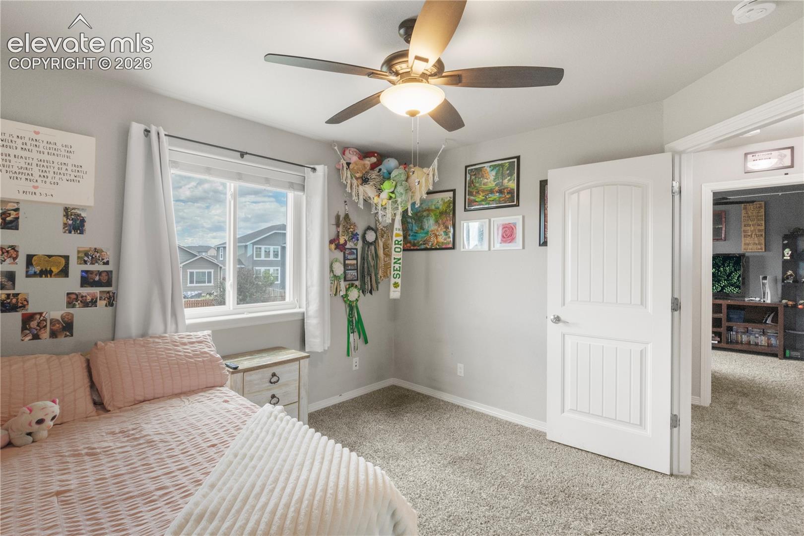 Recessed lighting, ceiling fan with light fixture, light gray wall paint, window with white trim, and light gray carpet flooring