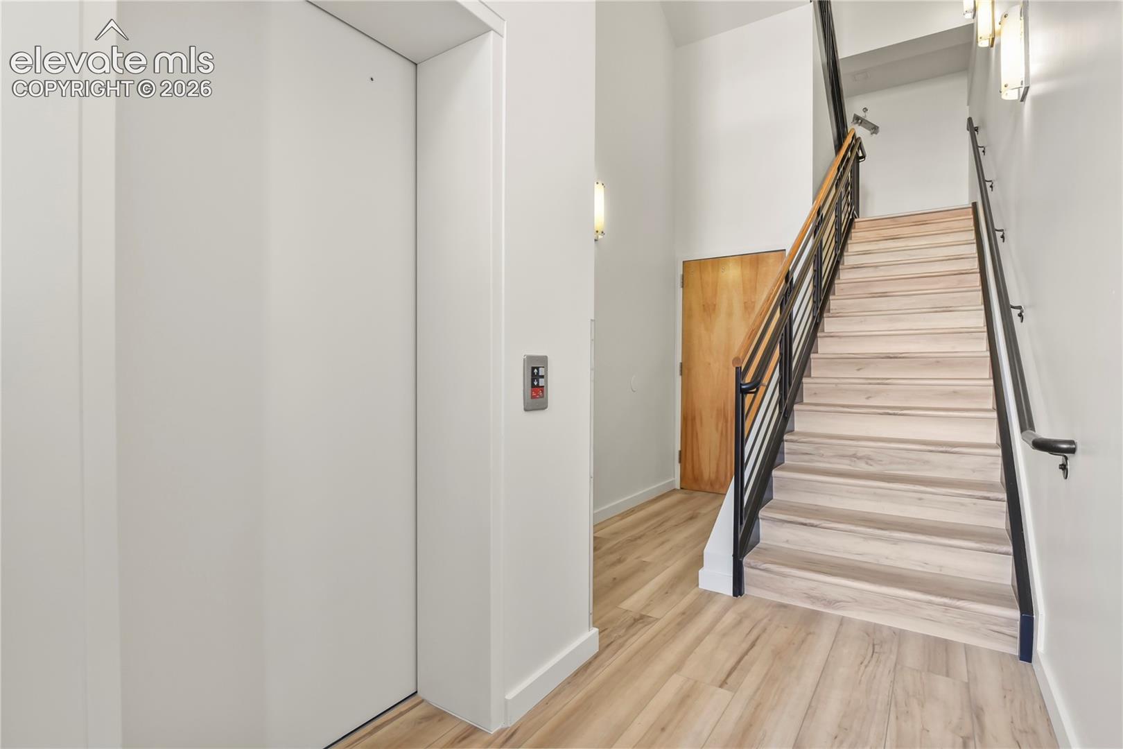 Common area entry was just renovated with new paint, flooring, and lighting