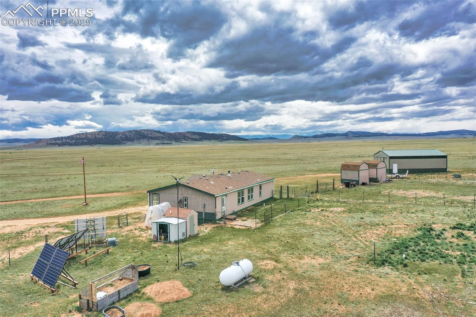 Back yard, solar panels, cold frame, and Distant Mts, the Mosquito Range