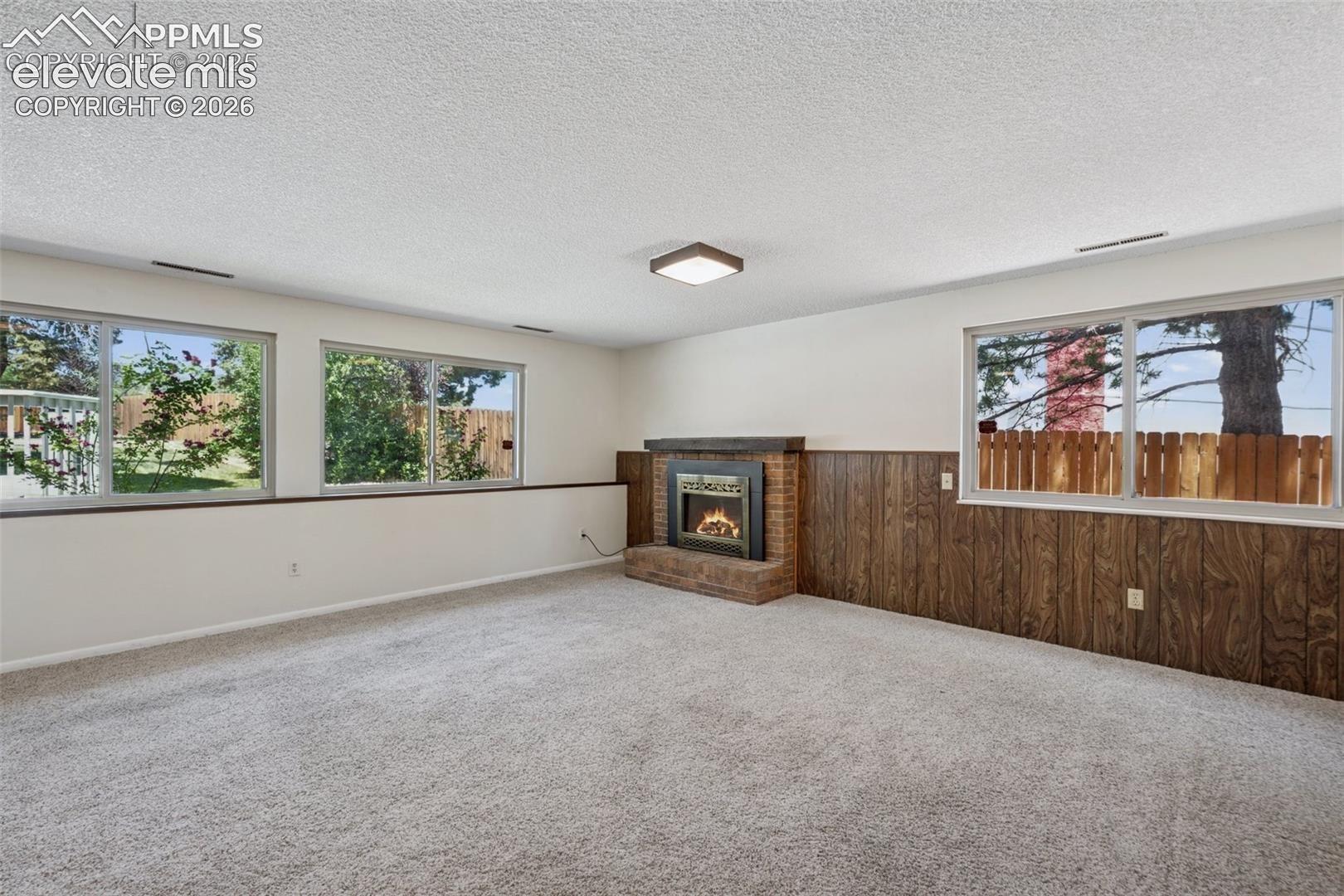Flexible Living and Dining Space (with furniture) Lower Level