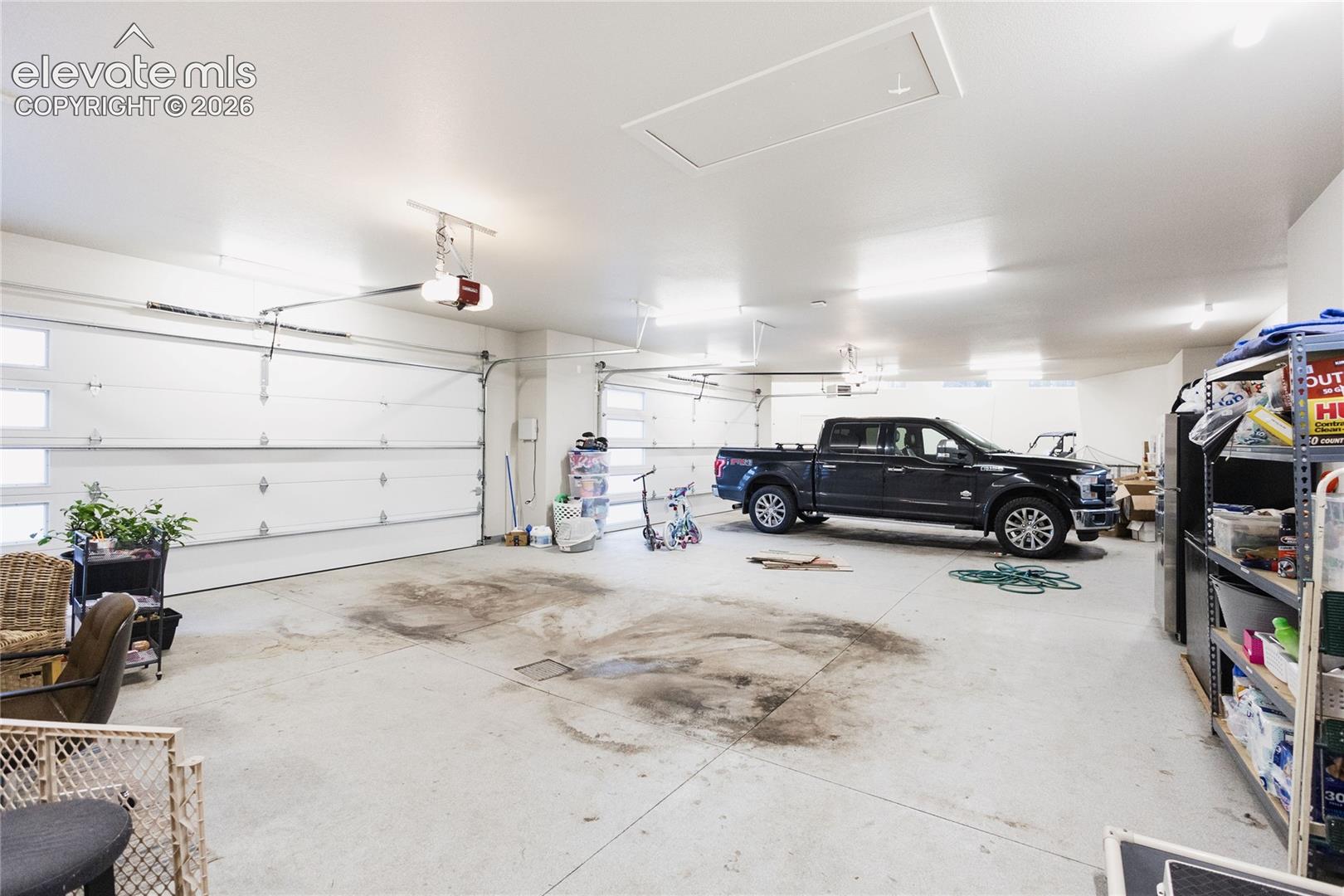 Garage featuring a garage door opener