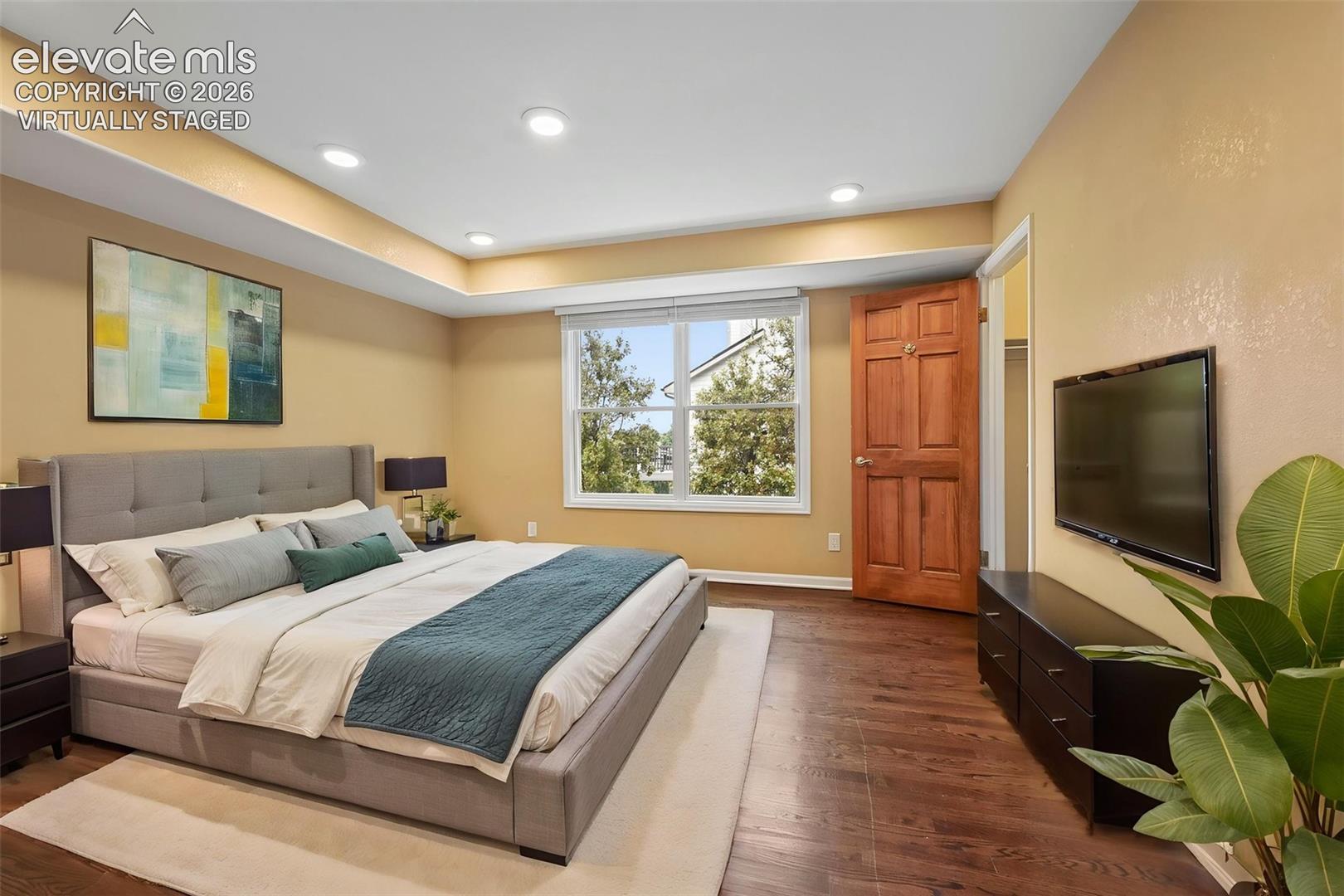 Virtually staged office on main floor, shown as staged bedroom for a main floor bedroom (6th br)