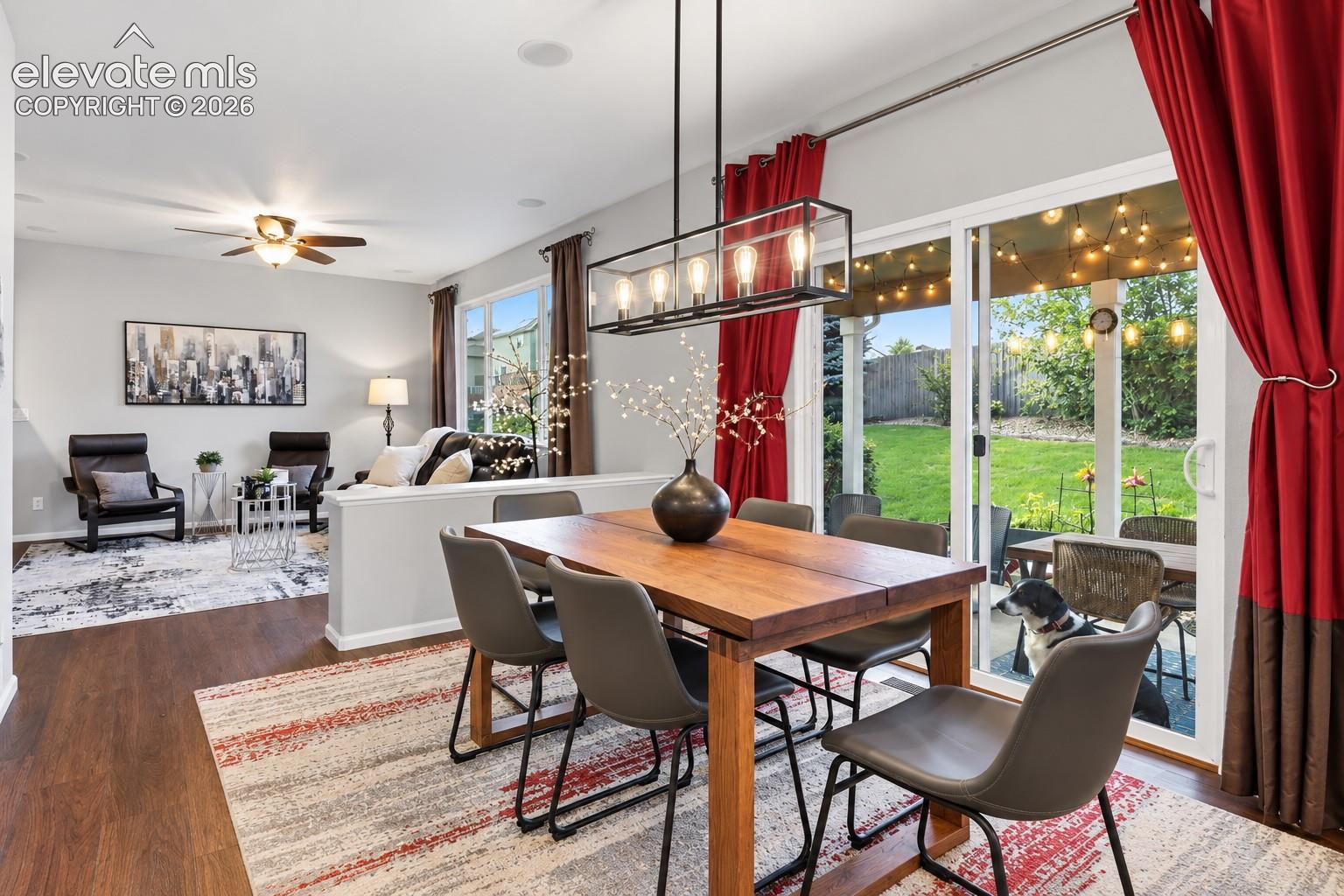 Dining flows naturally toward the backyard, bringing indoor and outdoor living together.