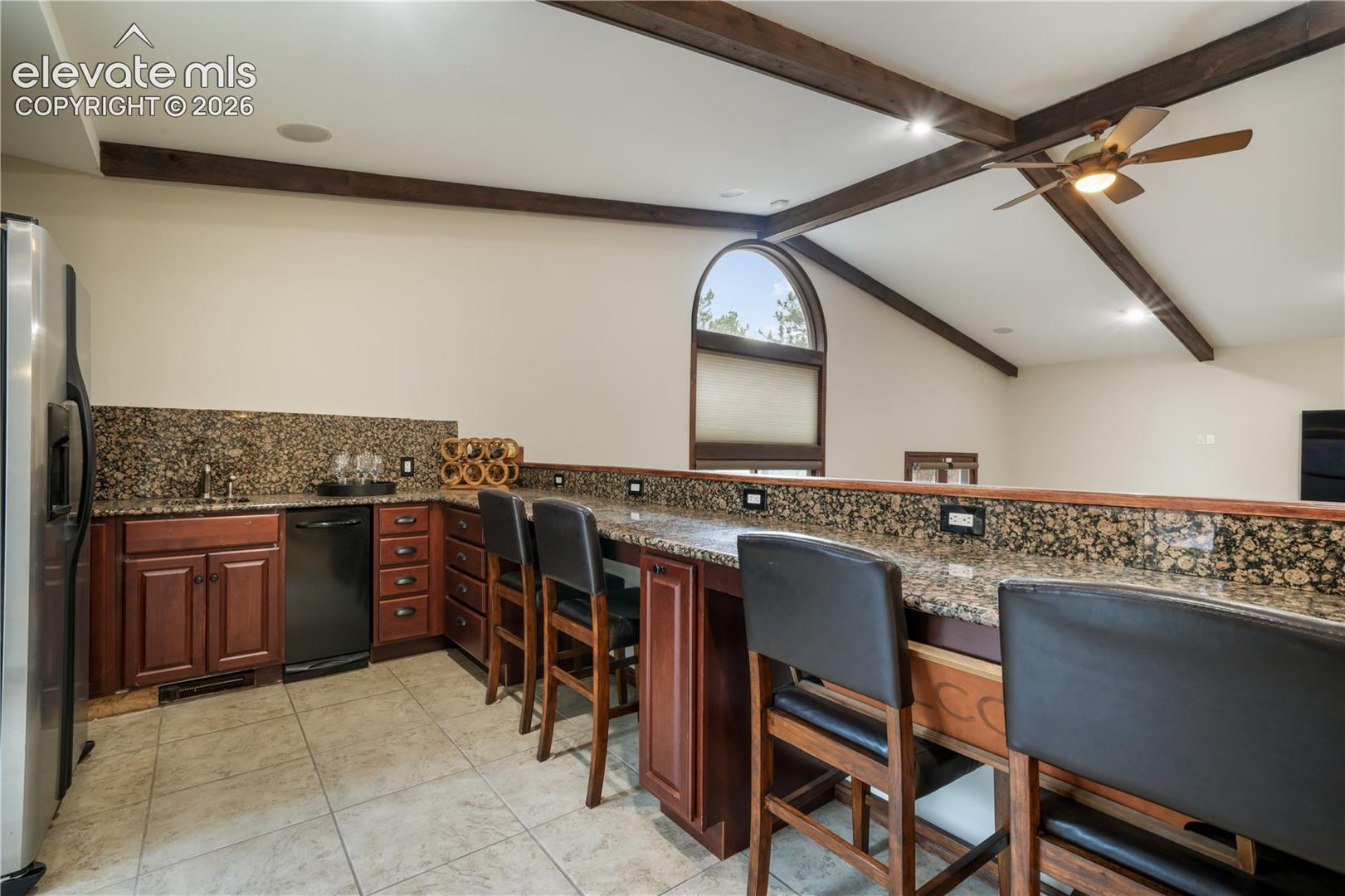 Tile flooring, granite counter tops, trash compactor and expansive bar