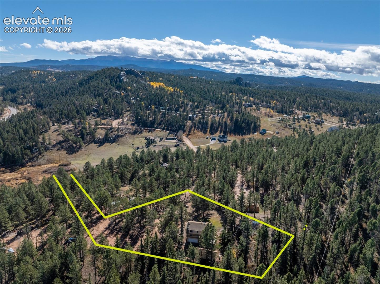 Aerial view house which sits on included Lot 106 with 2432 sq. ft. house on 3.24 acres. Property Lines are Approximate and not a survey.