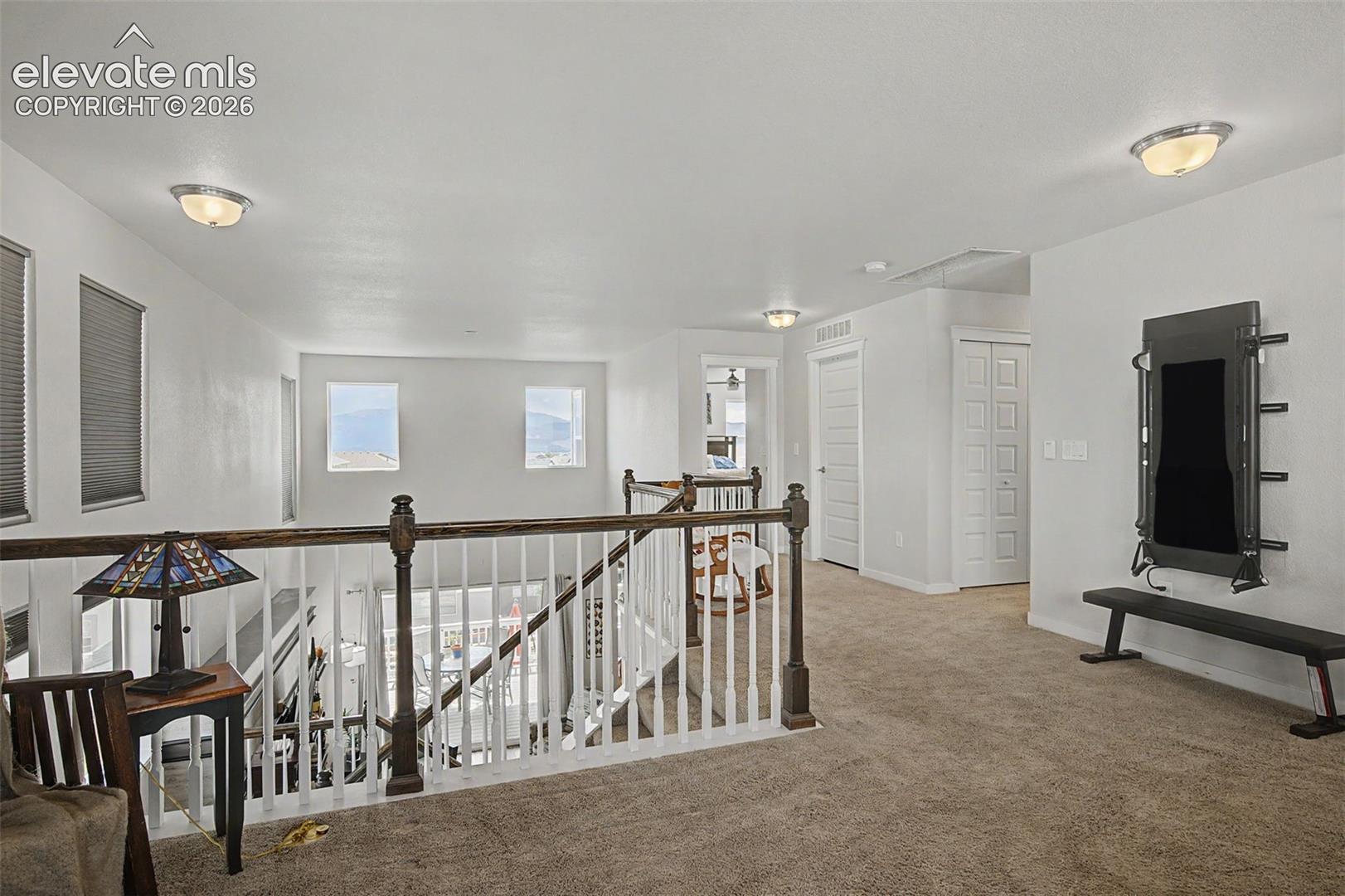 View of upper level hallway from loft.